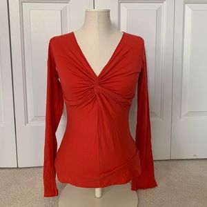 Orange Velvet v neck with detailed neck.